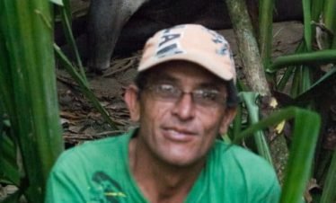 A tapir rests behind our guide in Corcovado National Park